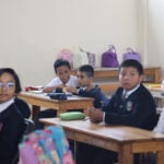 Primary school students in Oaxaca city at their desks.