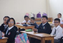 Primary school students in Oaxaca city at their desks.