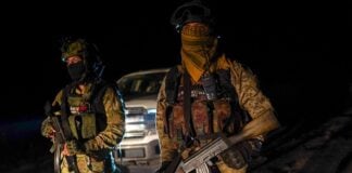 The Jalisco New Generation Cartel (CJNG), whose members are seen here patrolling near Morelia, Michoacán, continues to function largely as it did before El Mencho's death, according to OSAC.