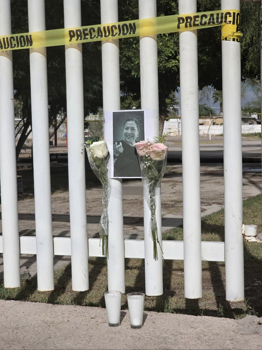 An altar to Nery Edith Narváez González with a photo and flowers outside Number 13 Secondary School in Ejido La Unión in Torreón, Coahuila.