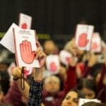 Morena party supporters holding up signage