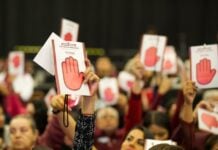 Morena party supporters holding up signage