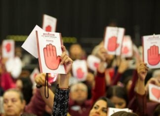Morena party supporters holding up signage