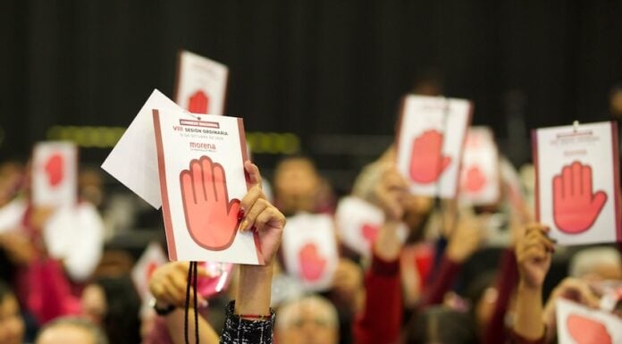 Morena party supporters holding up signage