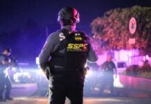 police officer looking out at a crime scene in Morelos