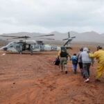 Soldiers and guardsmen on Monday rescued 32 people stranded outside Ensenada, Baja California, after a mudslide caused by Tropical Storm Rachel cut off their only escape route.