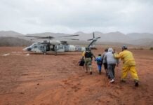 Soldiers and guardsmen on Monday rescued 32 people stranded outside Ensenada, Baja California, after a mudslide caused by Tropical Storm Rachel cut off their only escape route.
