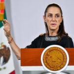 President Sheinbaum gestures behind the podium of her Wednesday October 21 press conference.