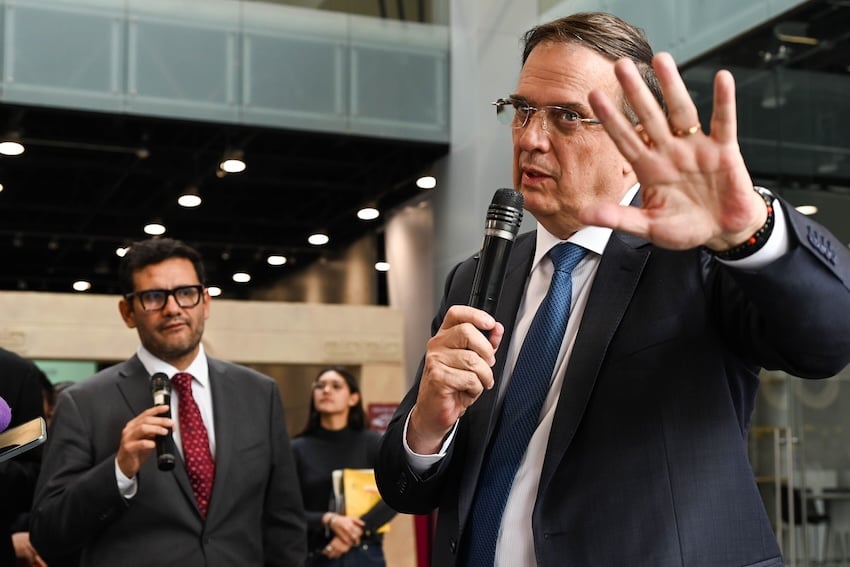 Ebrard at a press conference