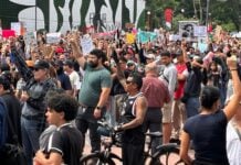 Protesters raise fists in solidarity at Guadalajara water protest.