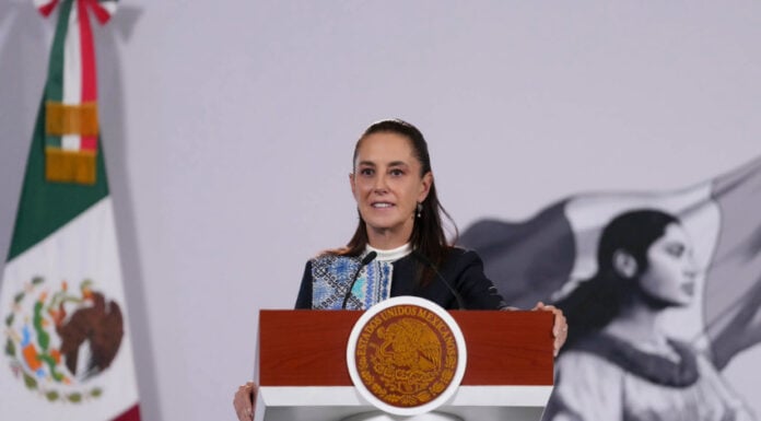 President Sheinbaum at the podium of her October 15 press conference