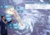 National Meteorological Service chief Fabián Vázquez gestures at a projection of the path of Hurricane Trudy along Mexico's Pacific coast