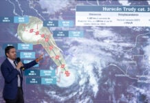 National Meteorological Service chief Fabián Vázquez gestures at a projection of the path of Hurricane Trudy along Mexico's Pacific coast