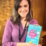 Sofía Robleda, holding a copy of her new novel, "The Other Moctezuma Girls."