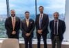 García alongside executives of Apollo Global Management