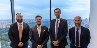 García alongside executives of Apollo Global Management