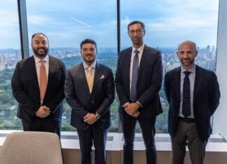 García alongside executives of Apollo Global Management