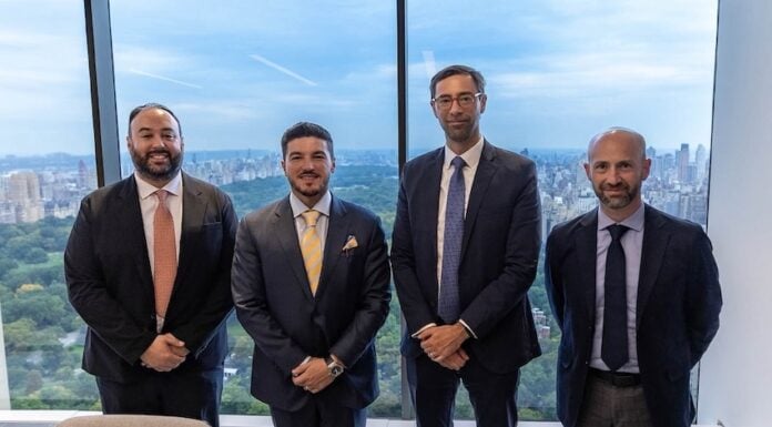 García alongside executives of Apollo Global Management