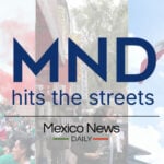 People wave Mexican flags behind text reading "MND hits the streets" and "Mexico News Daily"