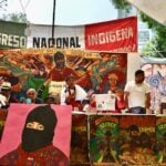 A speaker addresses the 30th anniversary of the Indigenous Congress in Mexico City.