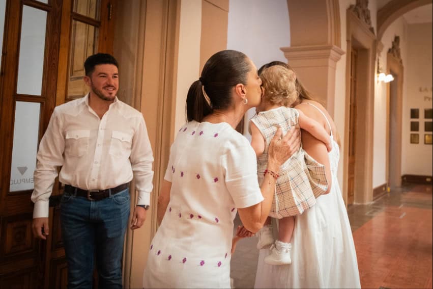 President Sheinbaum with the family of Nuevo León Gov. Samuel García, kissing a baby on the head