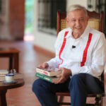 Former President Andrés Manuel López Obrador with his new book, "Pueblo"
