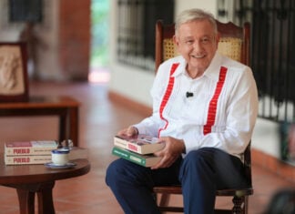 Former President Andrés Manuel López Obrador with his new book, "Pueblo"