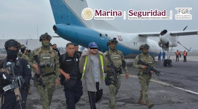 Mexican authorities escort accused fuel smuggler and former Navy officer Miguel Ángel Solano Ruiz, aka "Capitán Sol," onto a plane in handcuffs