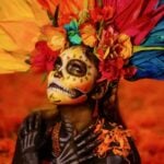 A portrait of a Catrina surrounded by iconic Día de Muertos symbols.