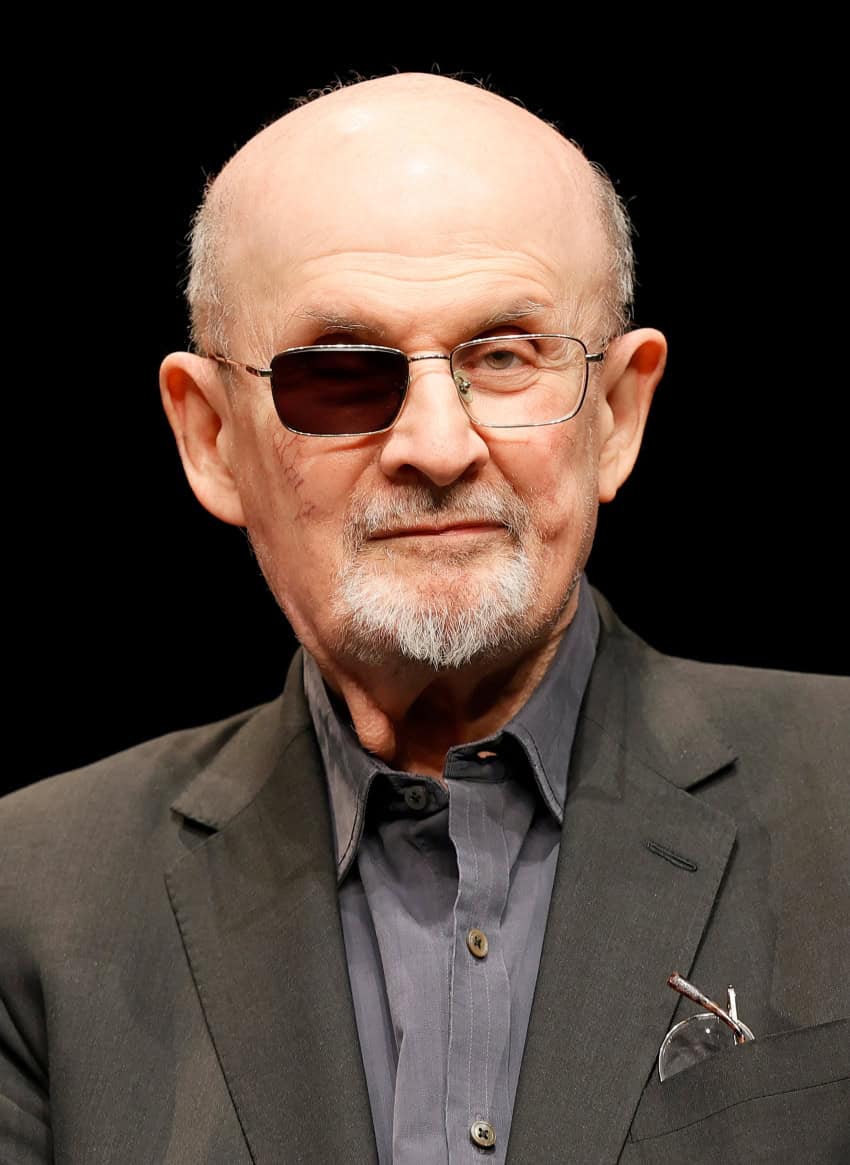Salman Rushdie shown against a black background
