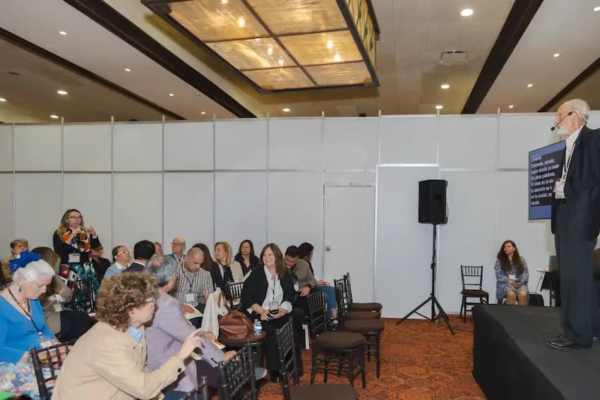 A speaker addresses a crowd at the inaugural San Miguel Forum.