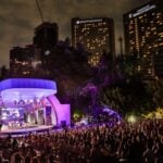 Night falls on the Polanco Jazz Festival in Mexico City, with the stage illuminated in purple lighting.