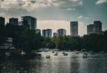 Mexico City highrise apartments with pedal boats on one of the man-made lakes in Chapultepec Park.