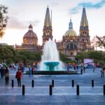 People gather near a water fountain at Plaza de la Liberación in Guadalajara, Mexico.