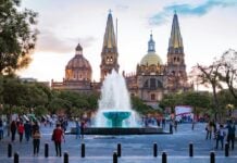 People gather near a water fountain at Plaza de la Liberación in Guadalajara, Mexico.