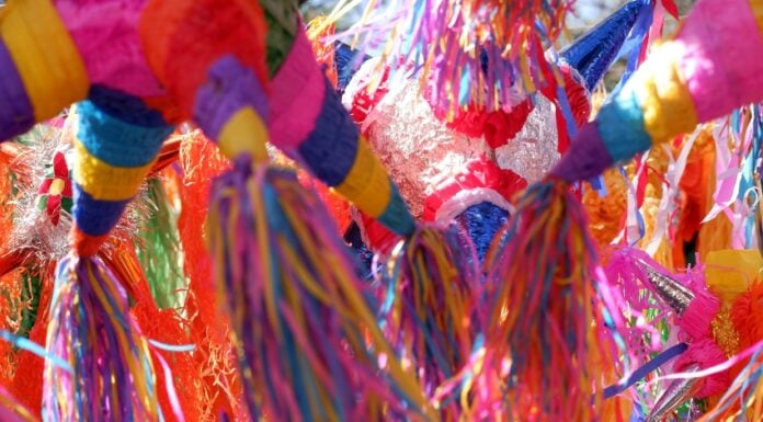 A close-up shot of multiple Mexican piñatas.