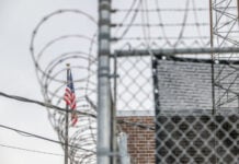 Chainlink fencing surrounds an ICE processing center in Broadview, Illinois.